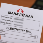 A close-up of a Mahavitaran electricity bill held in hand, showing consumer details and billing information.